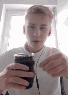 Guy Swallowing Tea Bag GIF