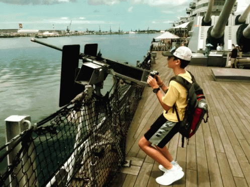 Guy Trying To Use Weapons On The Battleship GIF