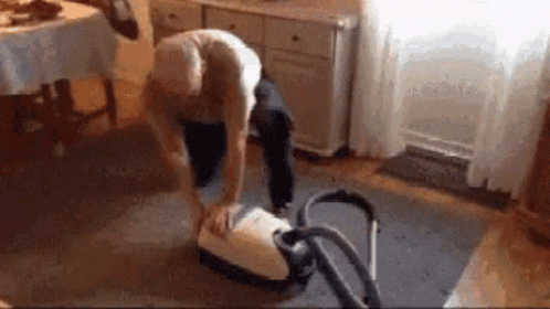 Guy Turning Vacuum Cleaner On GIF