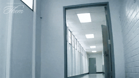 Guy Walking Fast In Hall Holding Files GIF