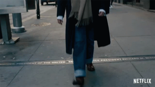 Guy Wearing A Long Coat Walking GIF
