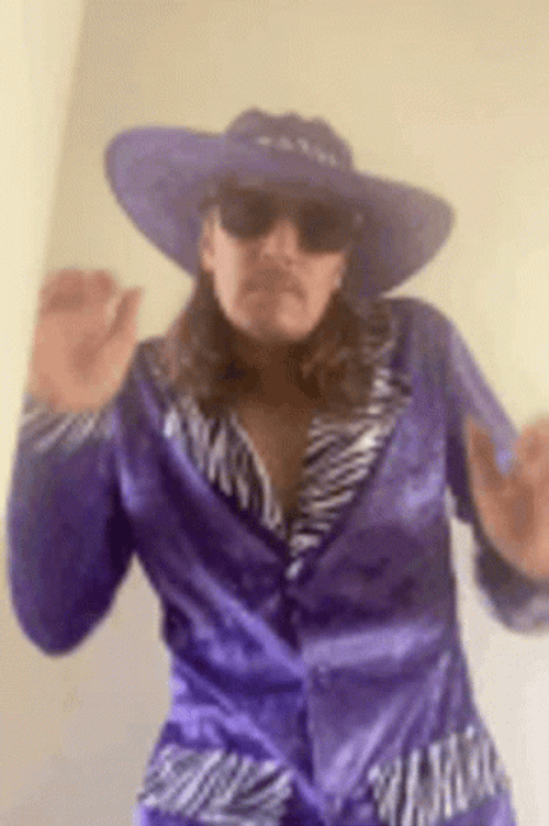 Guy Wearing Carnival 1980'S Pimp Costume GIF