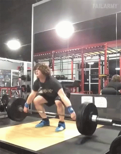 Guy Weight Lift Drops Single Leg Deadlift GIF