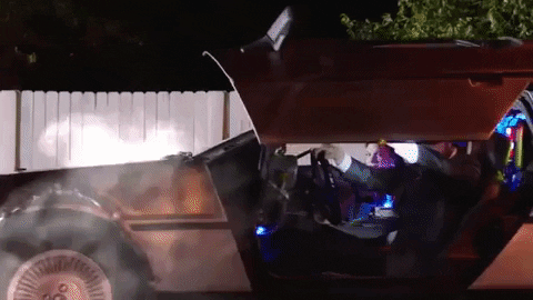 Guys Pushing Delorean On The Road GIF