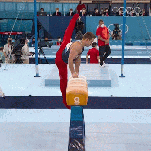 Gymnast Doing Split on Balance Beam