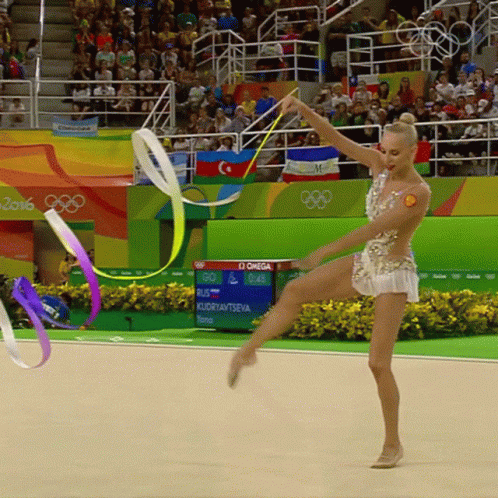 Gymnast Performing in Front of Omega Sign