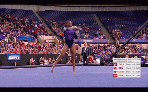 Gymnast Performing Trick in Front of ESPN Sign