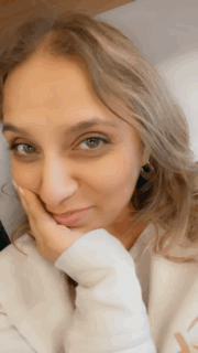 Hair Tuck Woman Wearing White Long Sleeve Top GIF