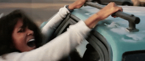 Halle Berry Hanging On Car Roof GIF