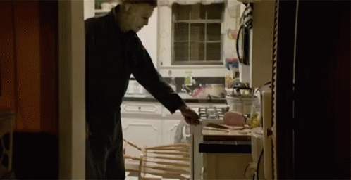 Halloween Kills Michael Myers Picking Up Knife GIF