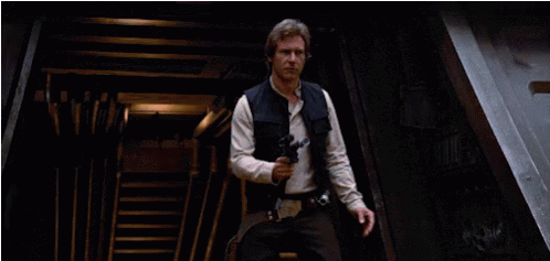 Han Solo From Star Wars Is Holding A Gun GIF