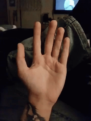 Man's Hand Clenched Movements GIF