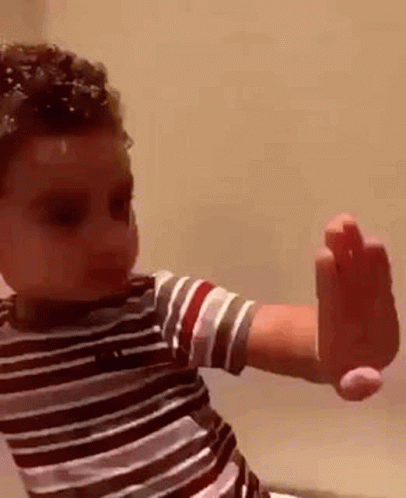 Hilarious Kid Inspecting Own Hand GIF