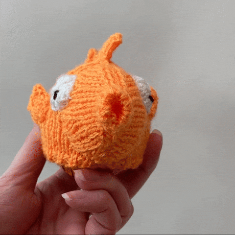 Hand Holding A Crochet Goldfish GIF