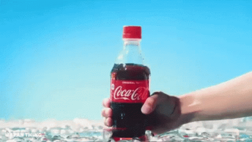 Hand Holding Coca Cola Bottle
