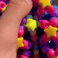 Hand Holding Colorful Beads