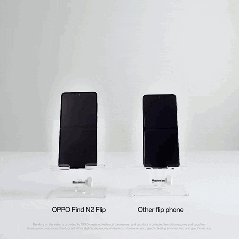 Hand Holding Oppo Find N2 Flip Phone Next to Another Flip Phone