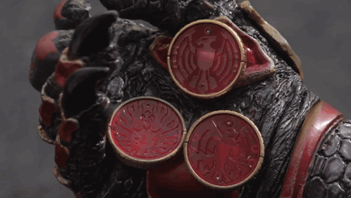Hand Holding Three Red Coins With Dragon