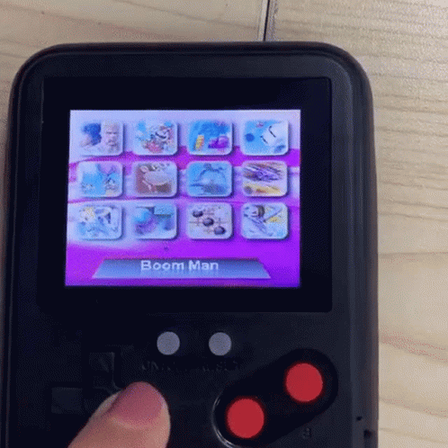 Hand Pressing Button on Boom Man Video Game