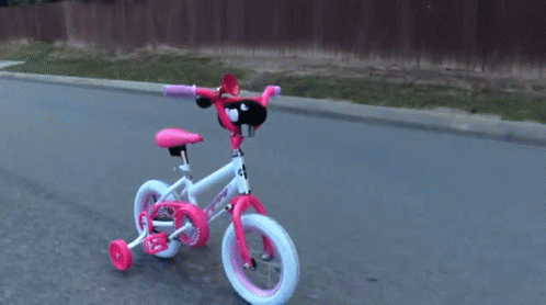 Hand Puppet Chasing Down Toy Bike GIF