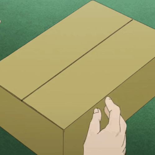 Hand Reaching For Cardboard Box On Green Surface GIF