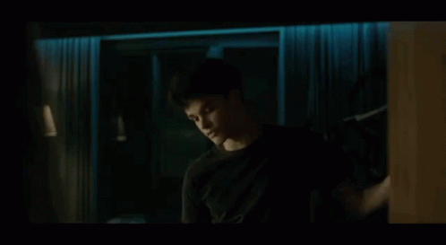 Hand Reaching Toward Door In Dark Room GIF
