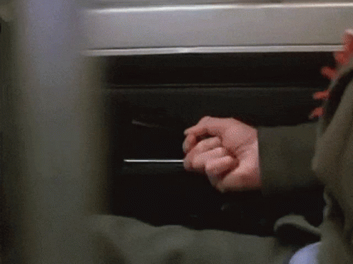 Hand Reaching Under Table