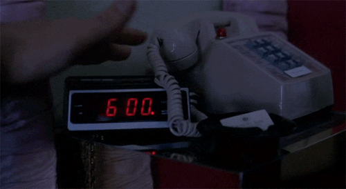 Hand Stopping Alarm Clock GIF