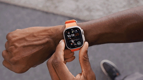 Hand Turning On Orange Apple Watch GIF