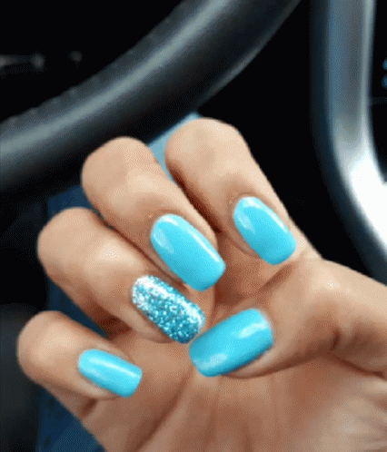 Hand With Blue Nails and Silver Glitter