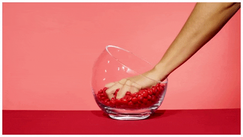 Handful Of Red Candies GIF