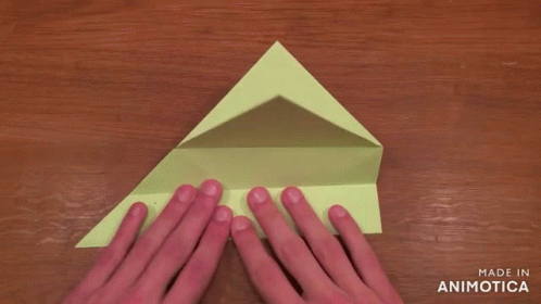 Hands Folding Green Paper With Made In Animotica