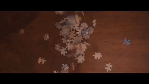 Hands Putting Puzzle Pieces Together GIF