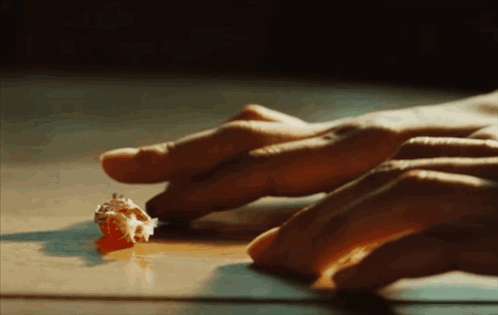 Hands Reaching for Small Object