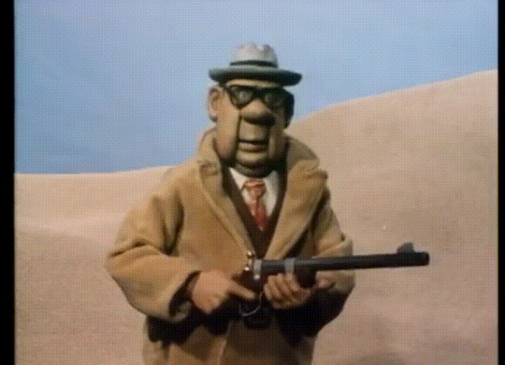 Hands Up Claymation In Desert GIF