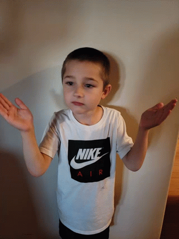 Handsome Boy Looking Left Right Wearing Nike T-shirt GIF