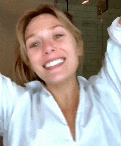 Happy Elizabeth Olsen Dancing Winking GIF
