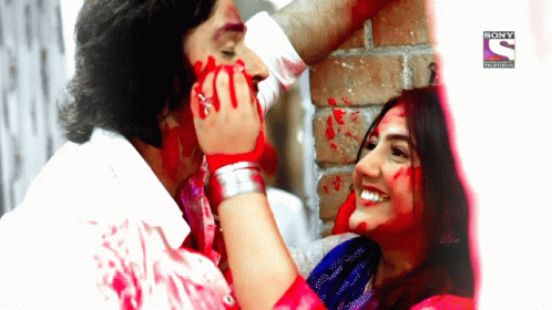 Happy Holi Couple Painting Face GIF