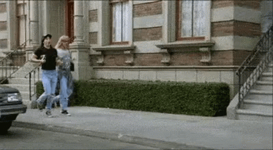 Happy Ladies Holding Hands Skipping GIF