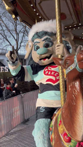 Happy Mascot On Merry Go Round GIF