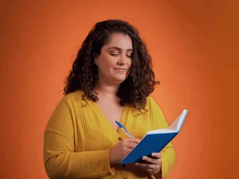 Happy Woman Planning On Notebook GIF