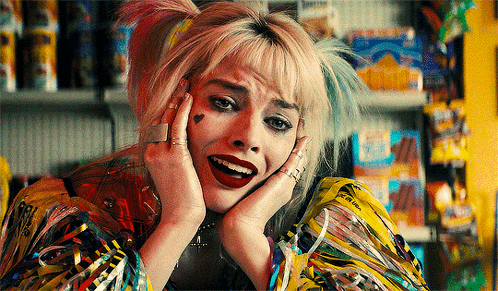Harley Quinn From Birds Of Prey Is Making A Face With Her Hands On Her Face GIF