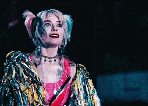 Harley Quinn From Harley Quinn Birds Of Prey Is Wearing A Colorful Jacket And A Choker . GIF