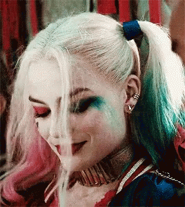 Harley Quinn From Suicide Squad Is Smoking A Cigarette While Wearing A Ponytail . GIF