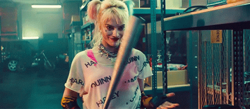 Harley Quinn Grin Holding Baseball Bat GIF