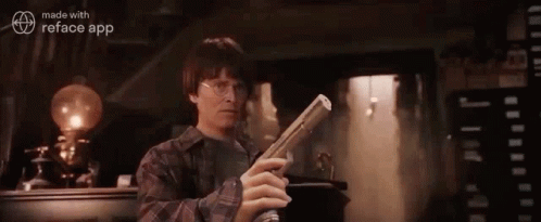 Harry Potter Is Holding A Newspaper In His Hand In A Room . GIF