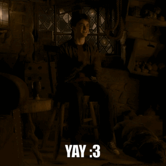 Harry Potter Is Sitting On A Stool In A Dark Room With The Words Yay : 3 Below Him GIF