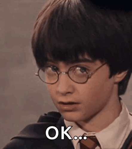 Harry Potter Is Wearing Glasses And A Tie And Is Making A Funny Face . GIF