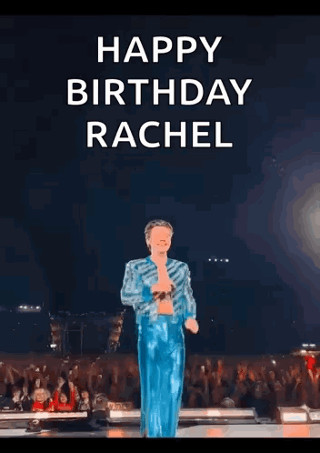 Harry Styles Is Standing On A Stage With His Arms Outstretched . GIF
