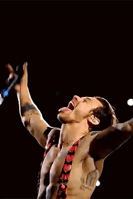Harry Styles Singing Into Microphone Shirtless On Stage